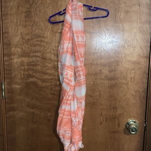 Light pink/orange/peach colored scarf
